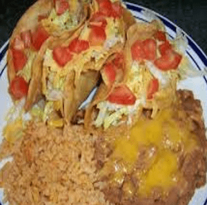 A plate of food with rice and beans on it.