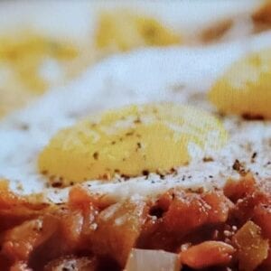 A close up of food with rice and meat