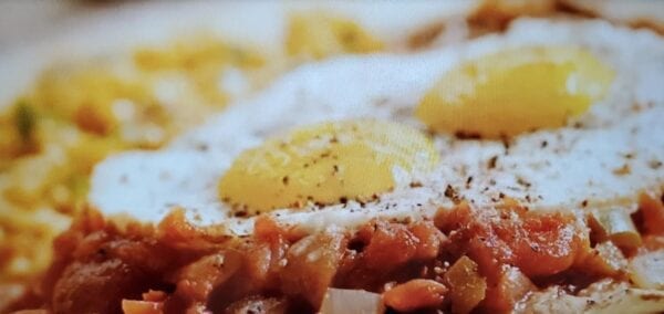 A close up of food with rice and meat